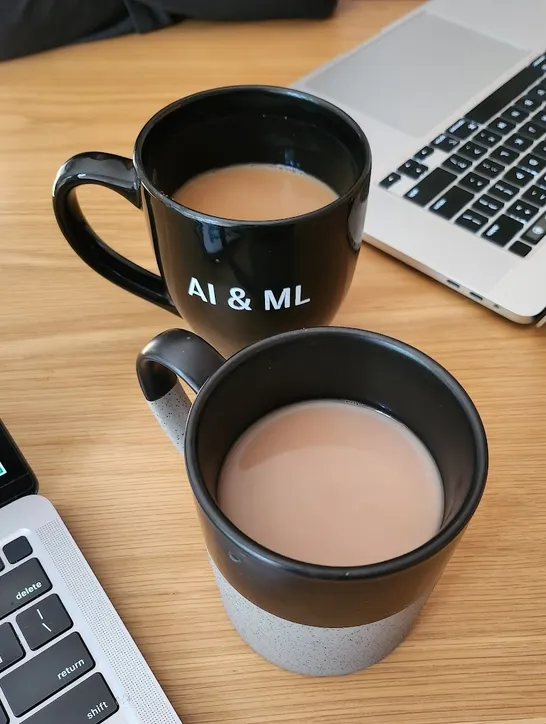 A coffee cup with AI & ML written on it