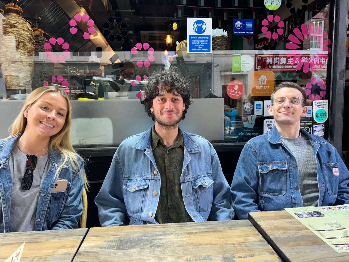 Samaya team with matching denim jackets about to eat lunch